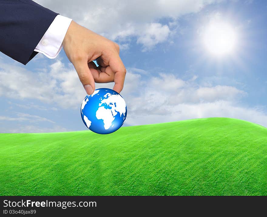 Hand holding globe to protect the fragile environment