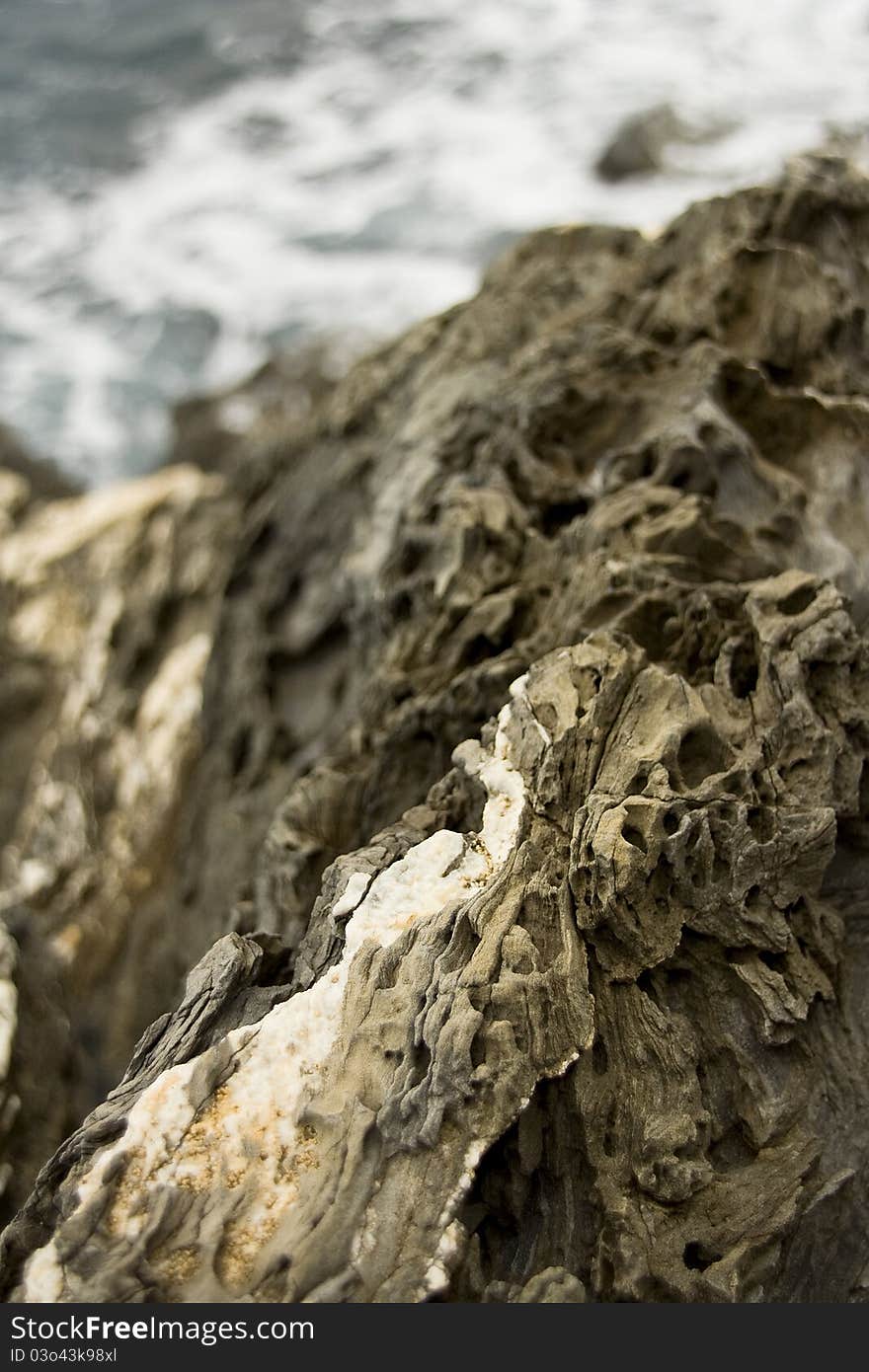 Close up view of the coastal rocks along the Cinque Terre coast in Italy.