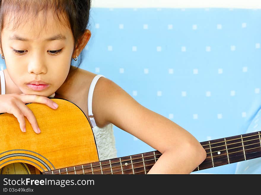 Young girl and guitar