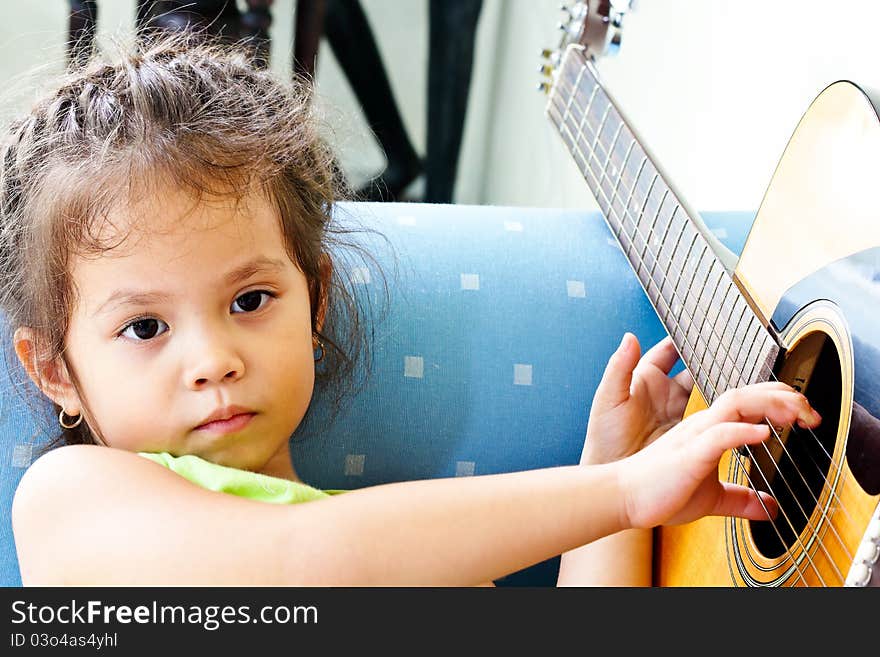 Children Are Thought To Play A Guitar Or Something