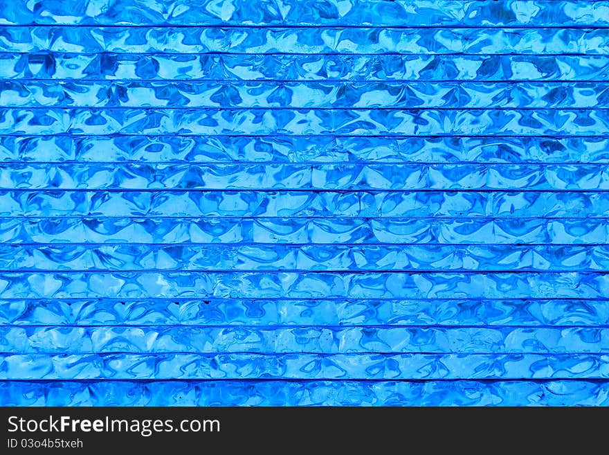 Abstract pattern of blue glass background