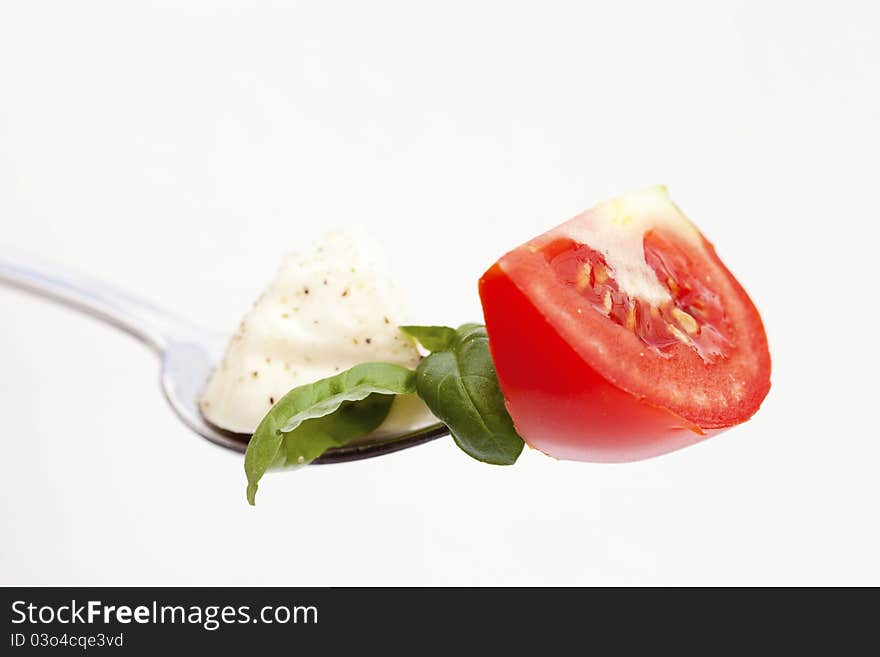 Tomato on fock isolated on white