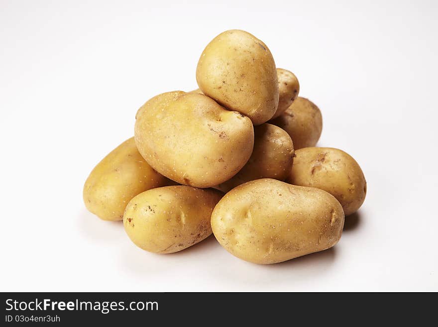 Some potatoes on white background