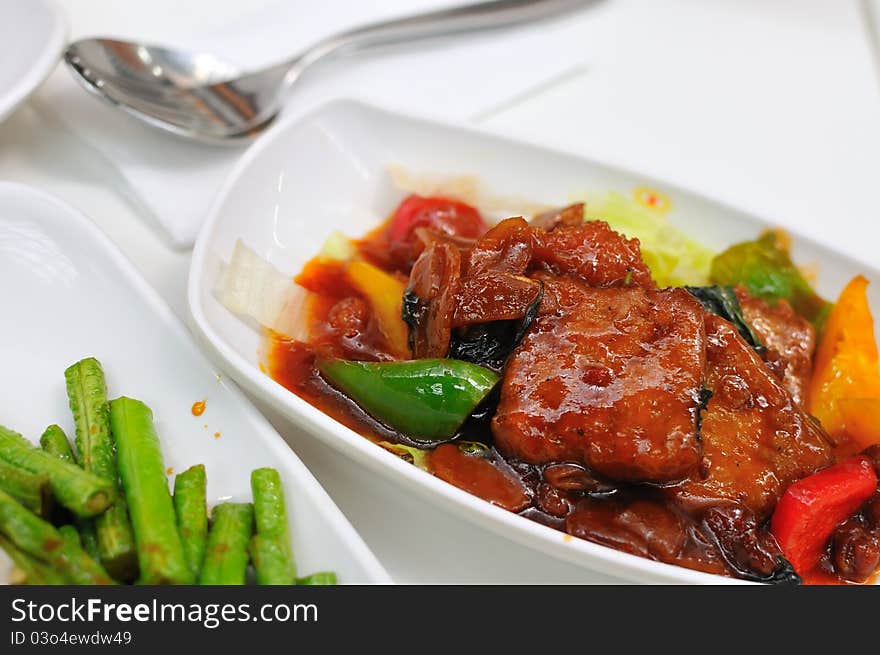 Deep fried vegetarian meat dish with colorful ingredients.