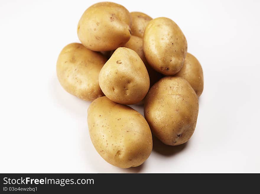 Some potatoes on white background