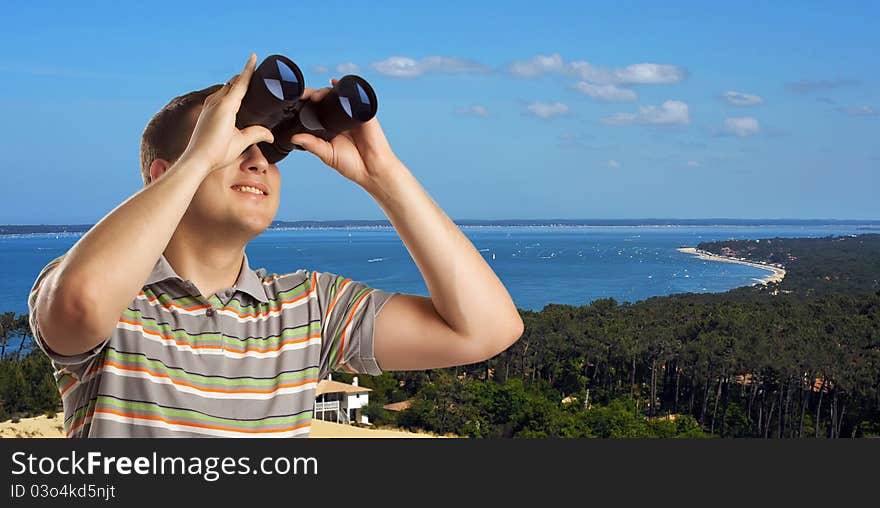 Tourist looking trough field-glasses