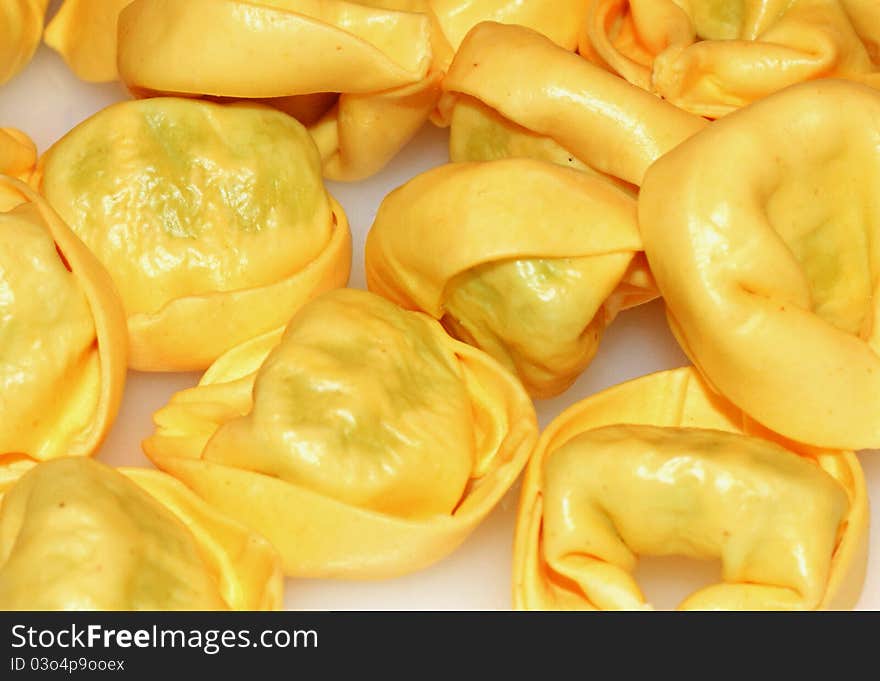 Tortellini - italian pasta with meat or cheese and other ingredients inside