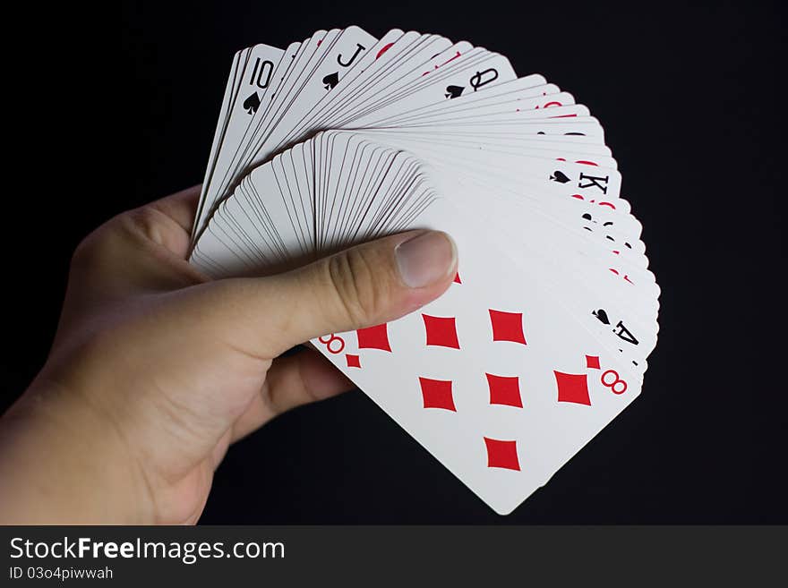 A full deck of cards with a hidden royal flush. A full deck of cards with a hidden royal flush