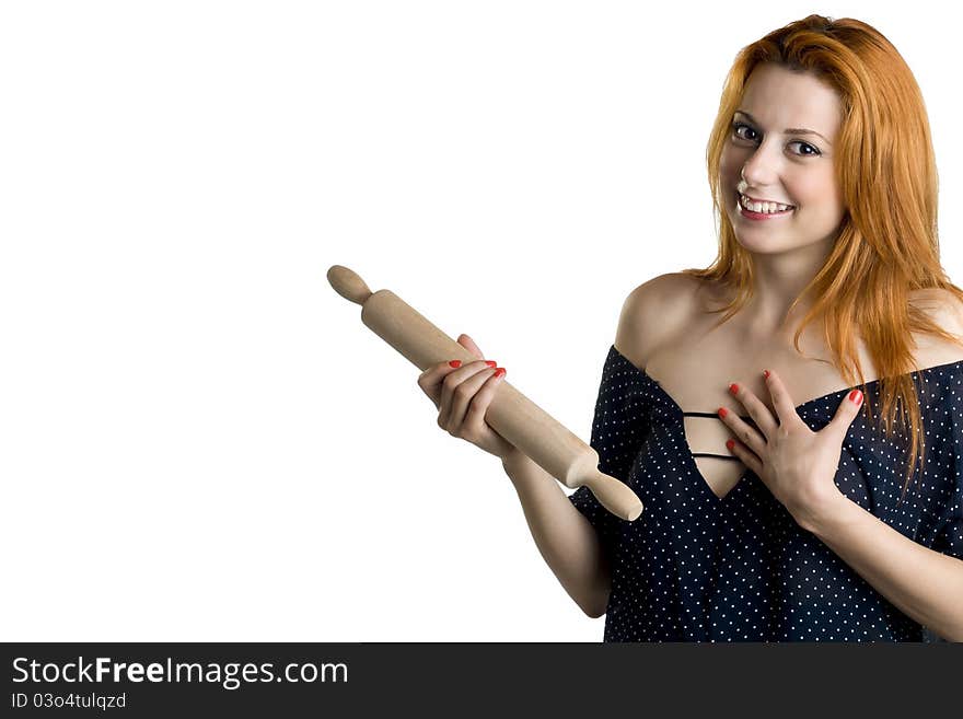 Young woman with a wooden rolling pin