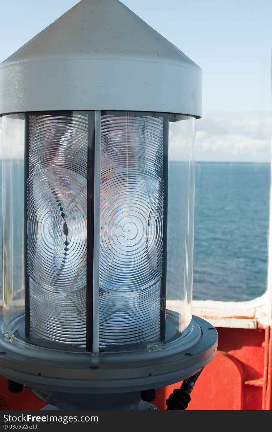 Close up of the huge lens around the light in an old lighthouse on Prince Edward Island. Close up of the huge lens around the light in an old lighthouse on Prince Edward Island