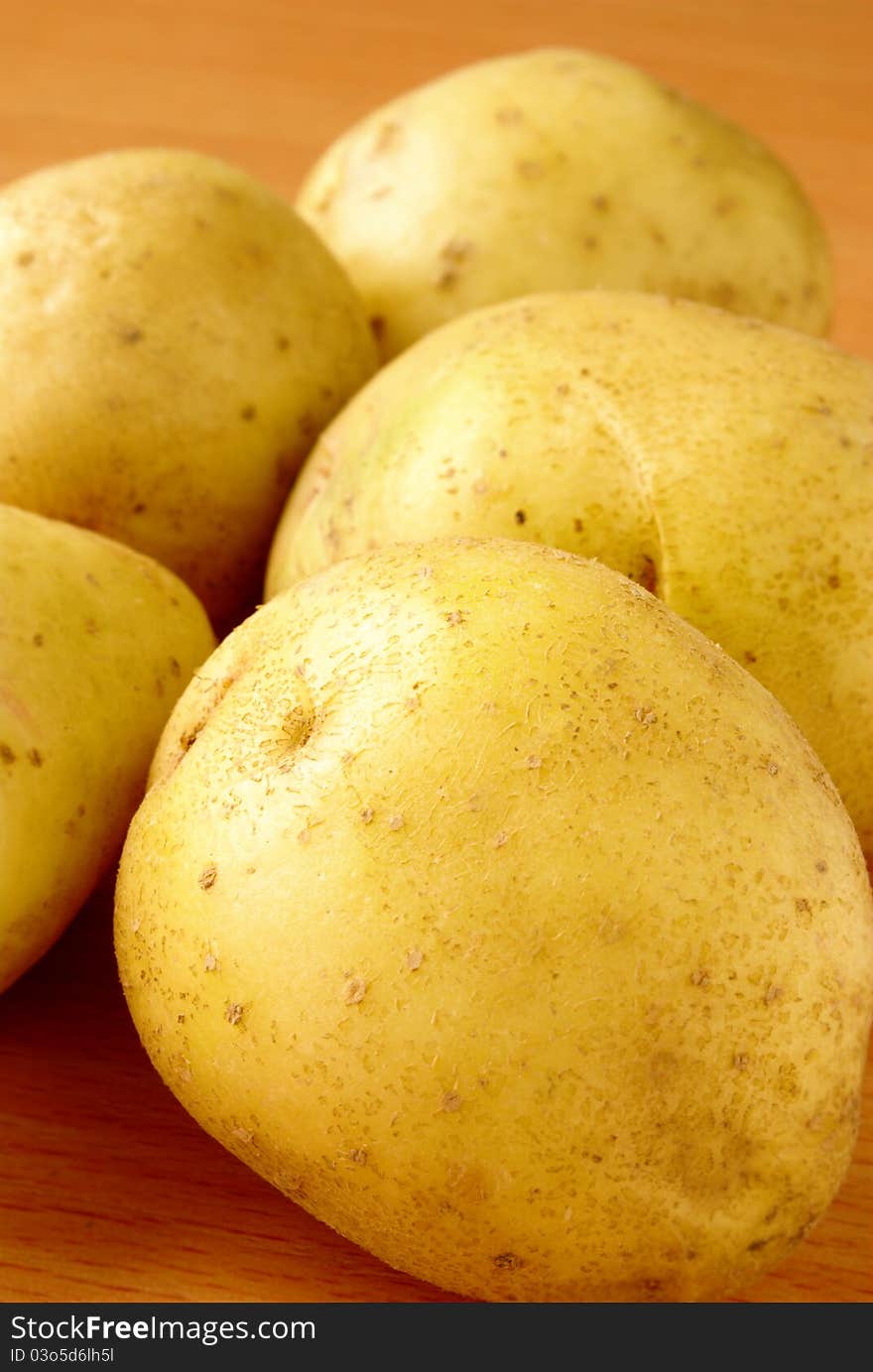 Tubers of potatoes on the table