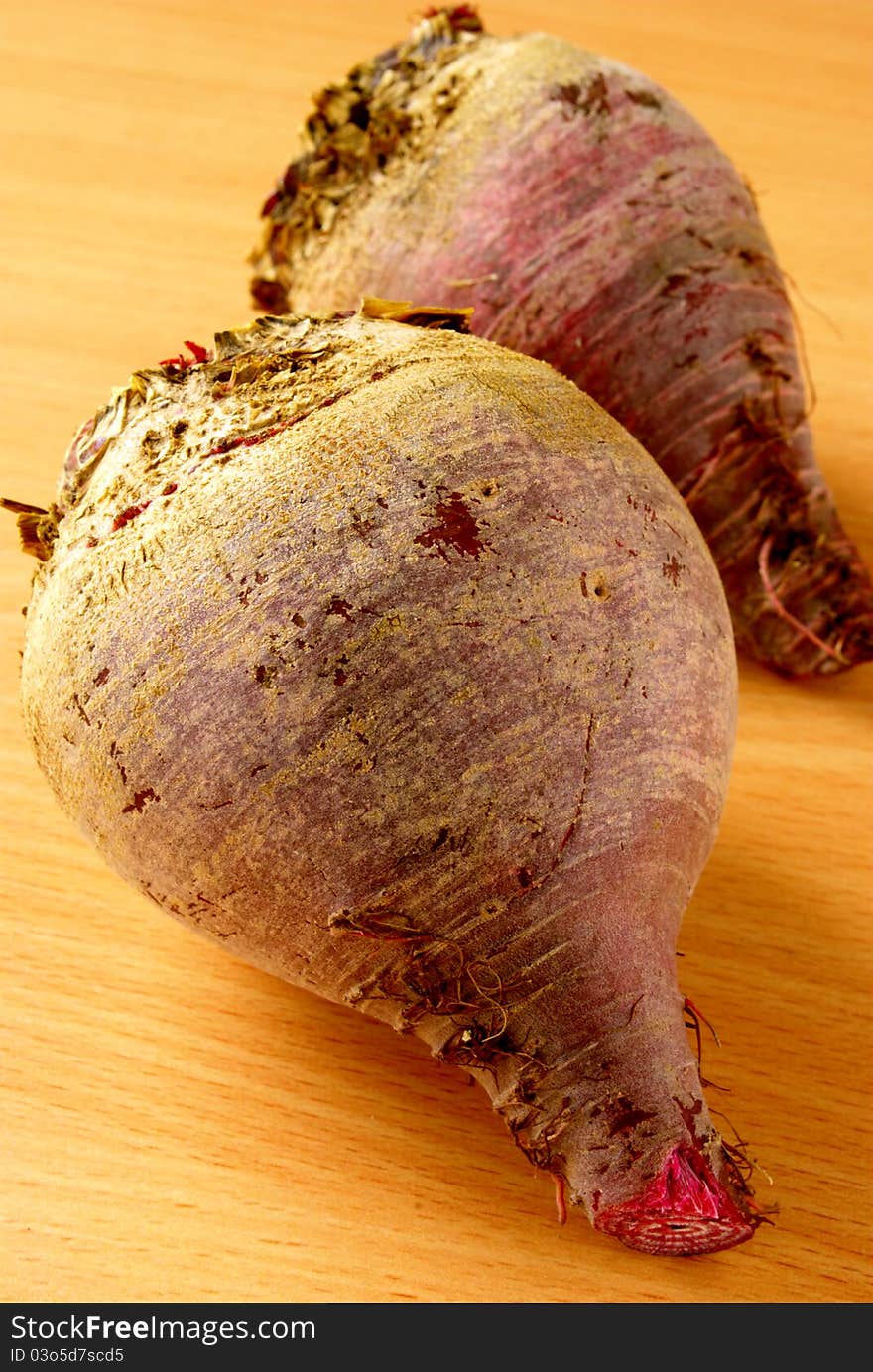 Two red beets on the table