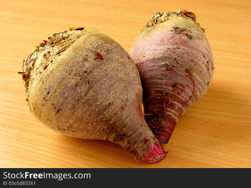 Two red beets on the table