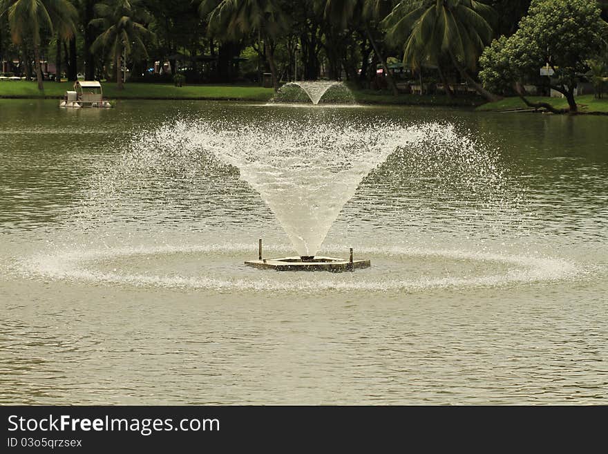 Fountain with round water drop in lake. Fountain with round water drop in lake