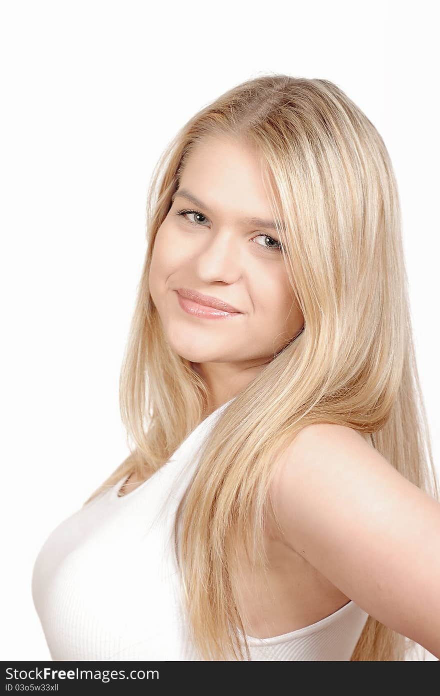 Pretty young woman posing. She has blond hair white tank top and very nice smile. Pretty young woman posing. She has blond hair white tank top and very nice smile.