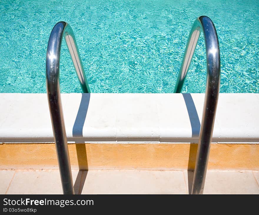 Outdoor pool handle in summer day