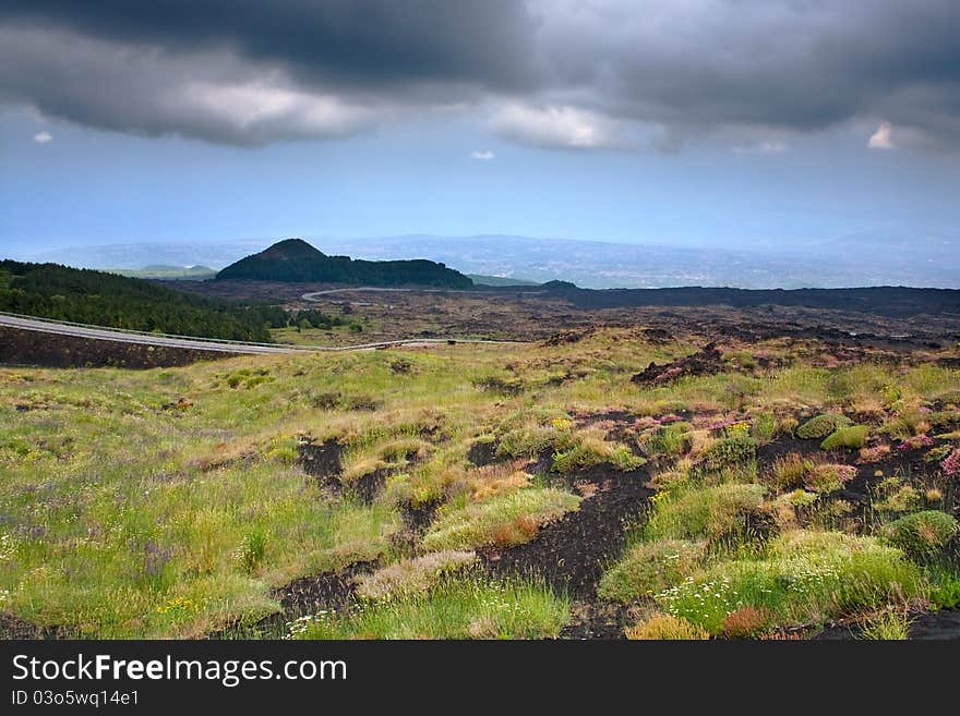 Mountain road in clinker ground on volcano Etna, Sicily. Mountain road in clinker ground on volcano Etna, Sicily