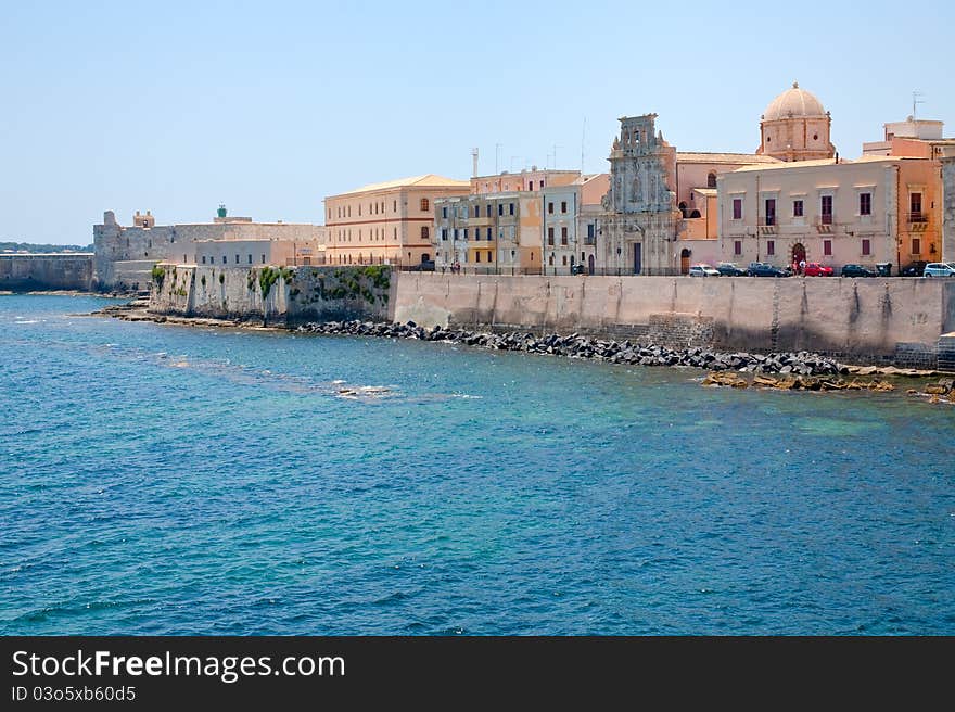 View on Castello Maniace and embankment in Syracuse, Sicily in summer day