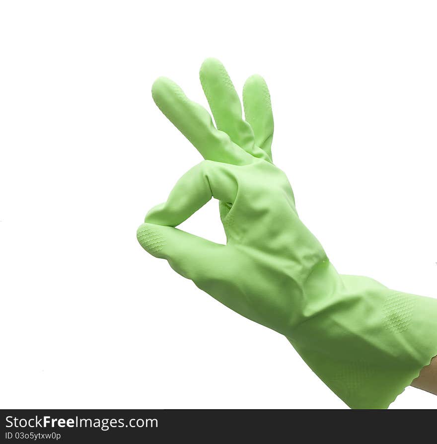 Hand of housewife in a green kitchen glove gesturing OK isolated on white background. Hand of housewife in a green kitchen glove gesturing OK isolated on white background