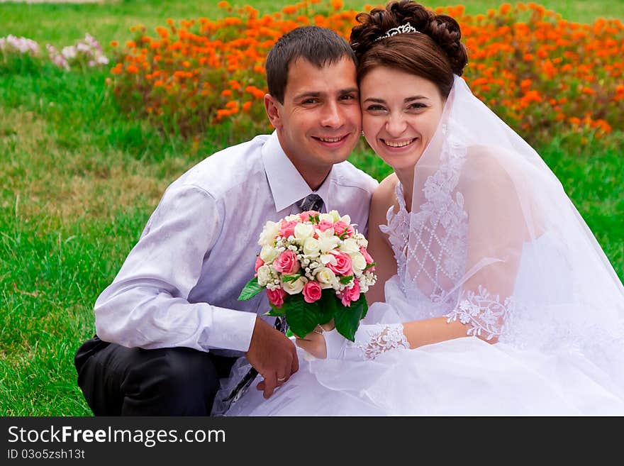 Happy smiling bride and groom. Happy smiling bride and groom