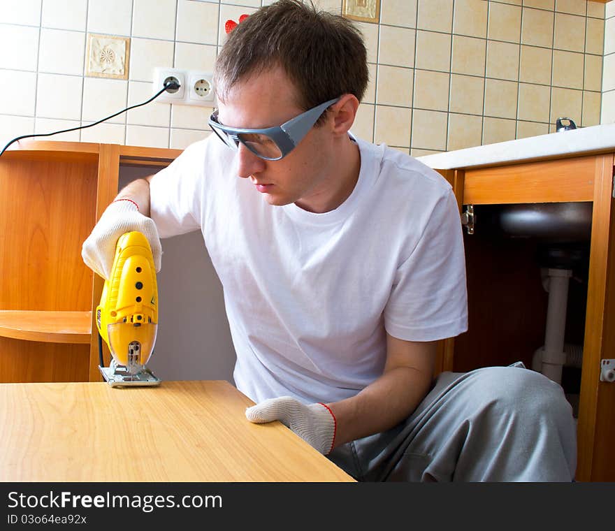 Man With An Electrofret Saw