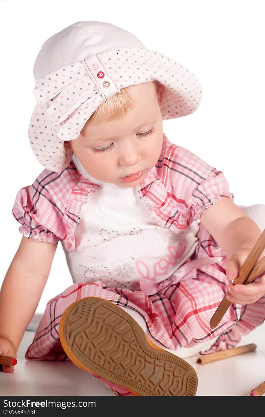 Little girl draws on the floor on white. Little girl draws on the floor on white