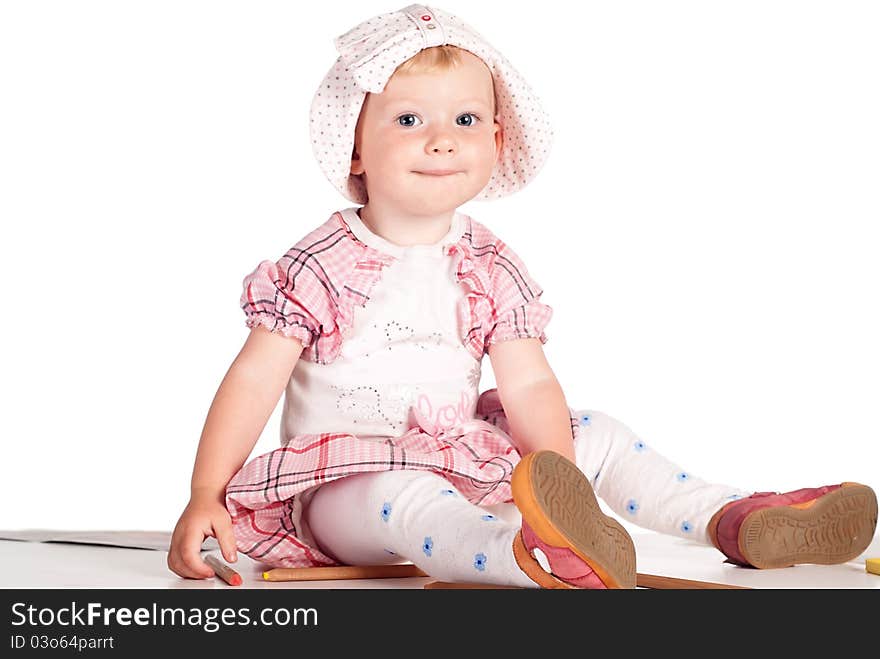 Little girl draws on the floor on white. Little girl draws on the floor on white