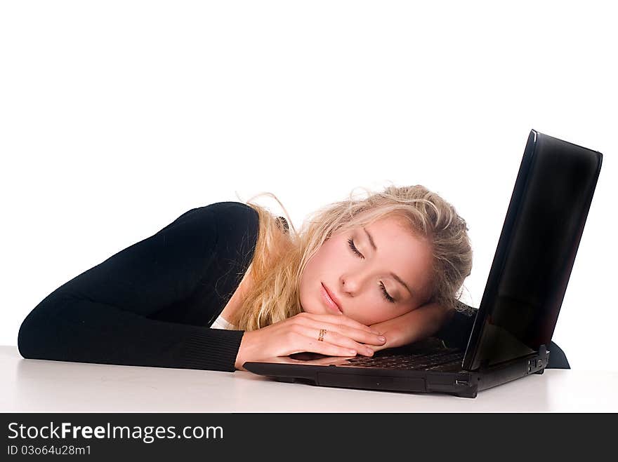 Cute blonde with a laptop at the table. Cute blonde with a laptop at the table