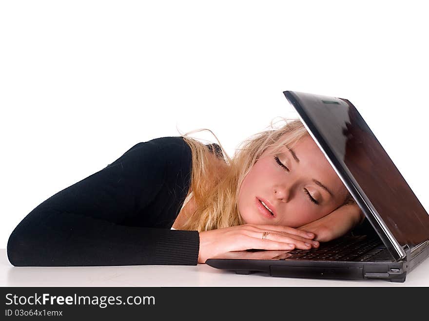 Cute blonde with a laptop at the table. Cute blonde with a laptop at the table