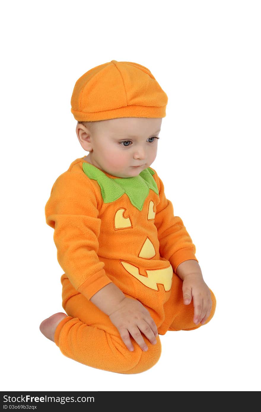 Baby dressed in a pumpkin costume on white background. Baby dressed in a pumpkin costume on white background