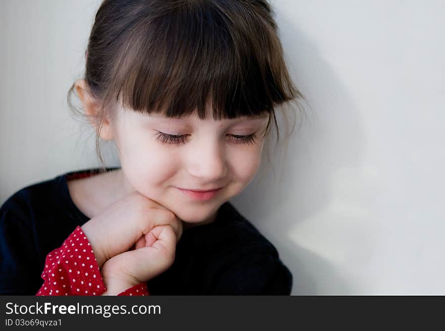 A Portrait Of Cute Smiling Child Girl