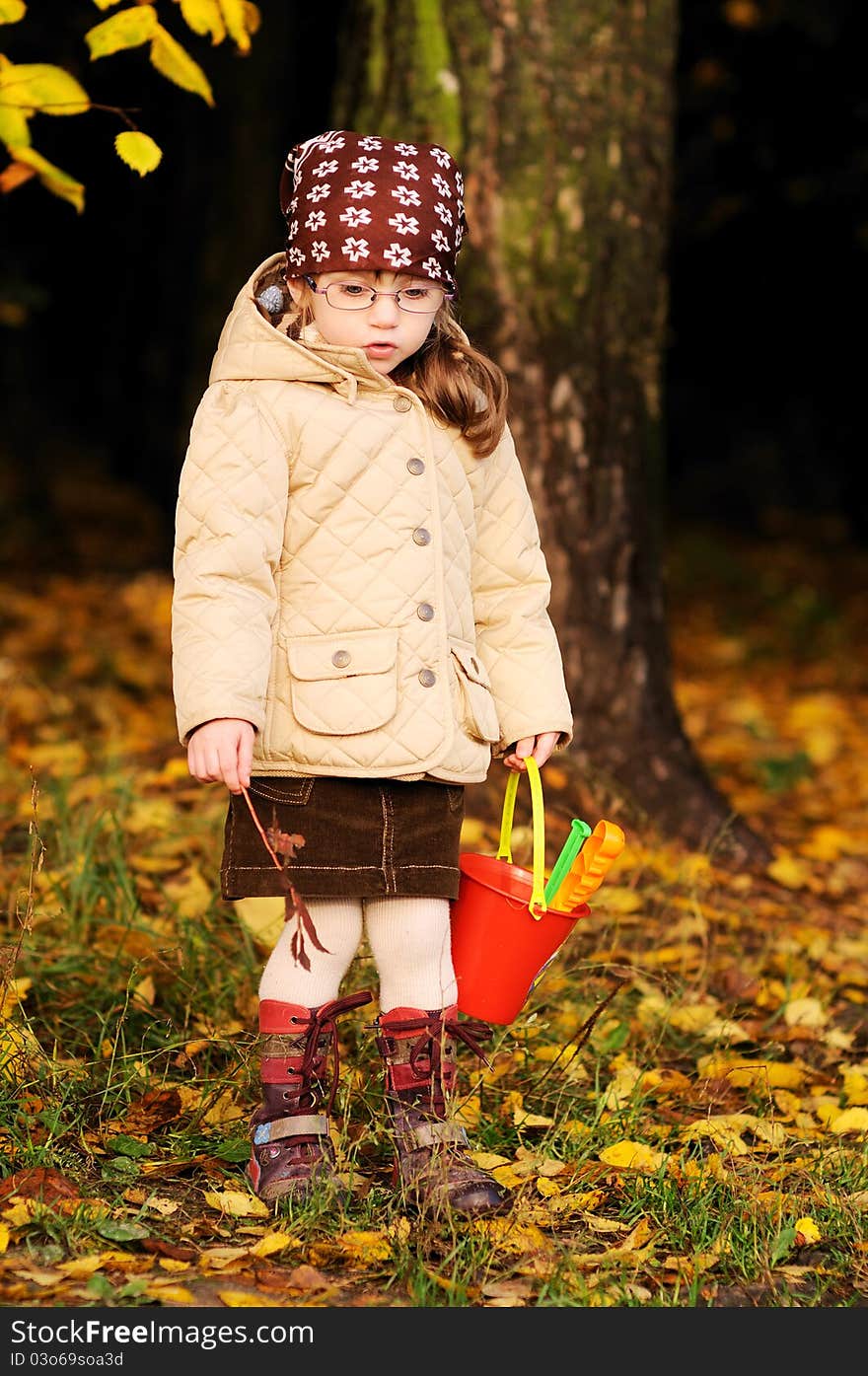 Full lenght portrait of adorable toddler girl in autumn forest. Full lenght portrait of adorable toddler girl in autumn forest