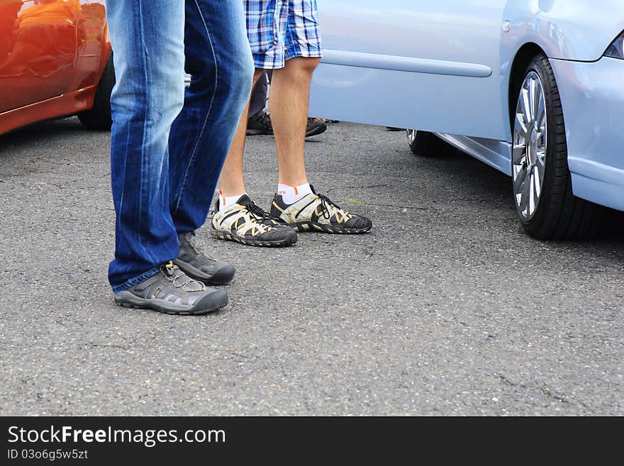 People around cars on tuning show.