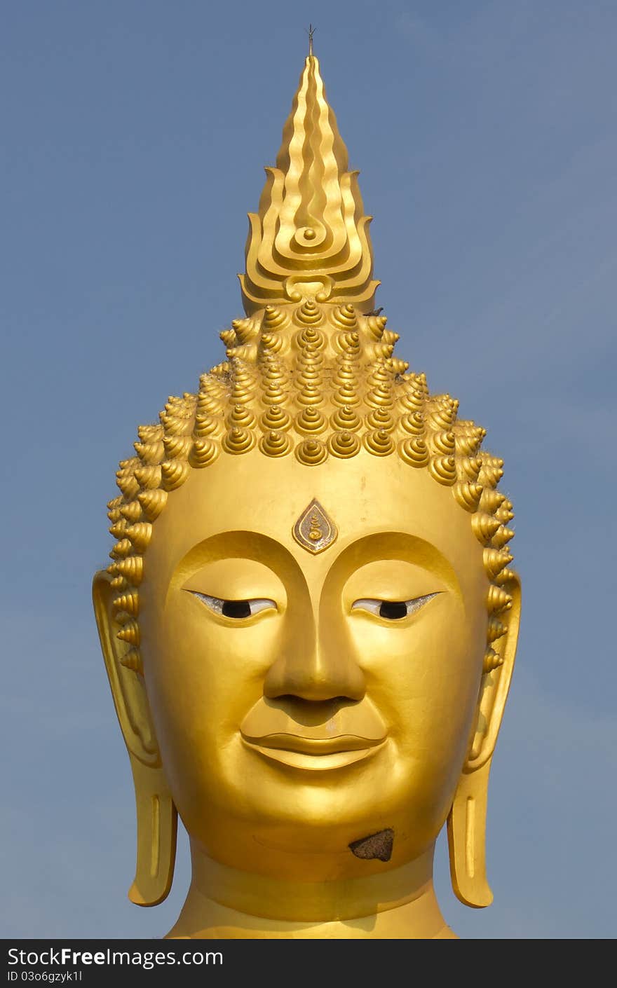 Large golden Buddha. In a temple in Thailand.