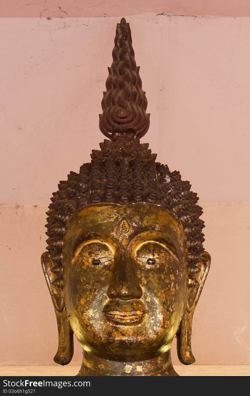 Brass Buddha in a temple in Thailand. Brass Buddha in a temple in Thailand.