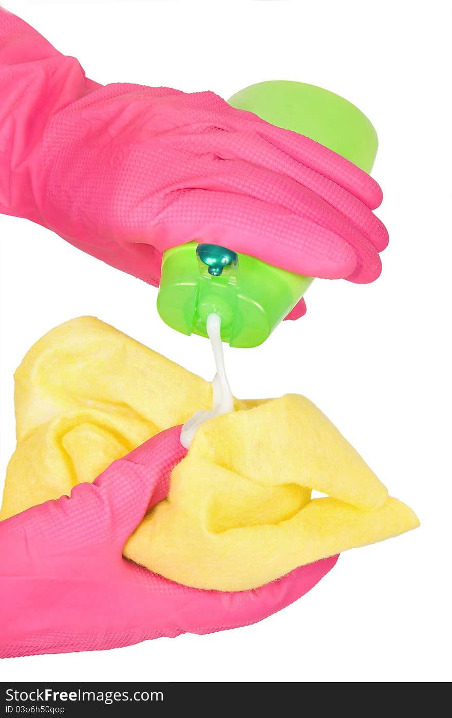 Hands in rubber gloves with a rag and bottle green. Hands in rubber gloves with a rag and bottle green