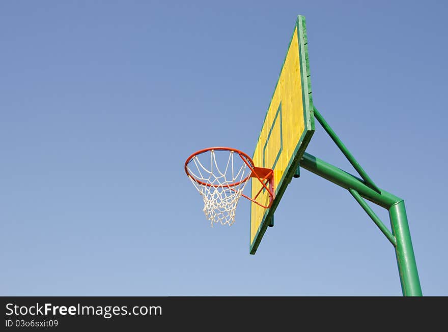 Yellow, red and green backboard on sky background