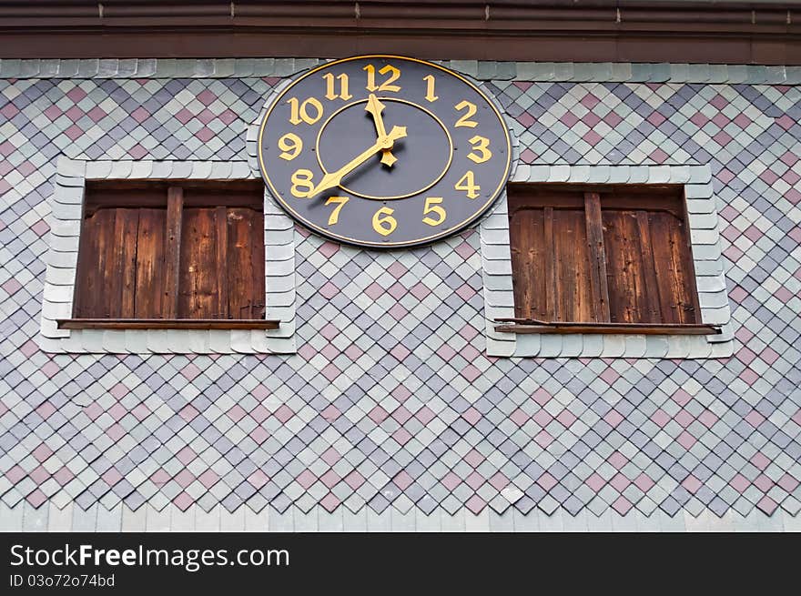 View of medieval clock on the outside of the church in Czermna, Poland. View of medieval clock on the outside of the church in Czermna, Poland.