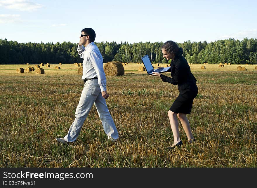 Teamwork at the field. two person and laptop. Teamwork at the field. two person and laptop