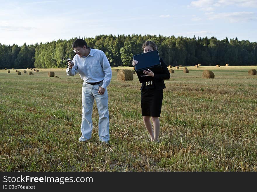 Teamwork at the field. two person and laptop. Teamwork at the field. two person and laptop