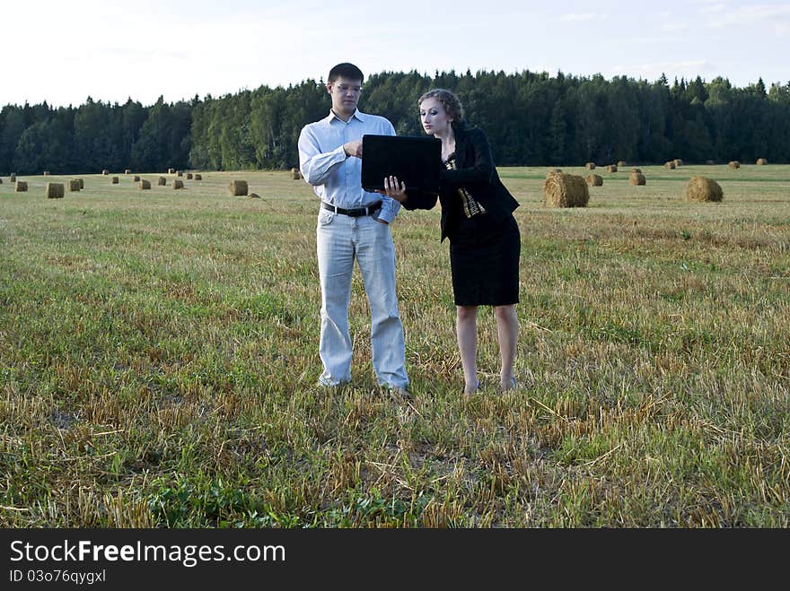 Teamwork at the nature. two person and laptop. Teamwork at the nature. two person and laptop