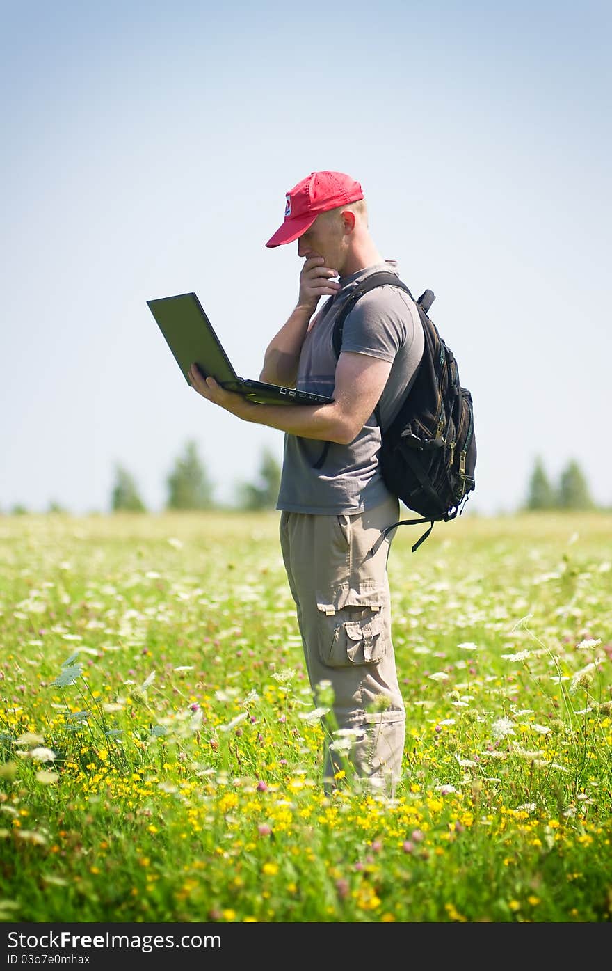 Young man working with laptop