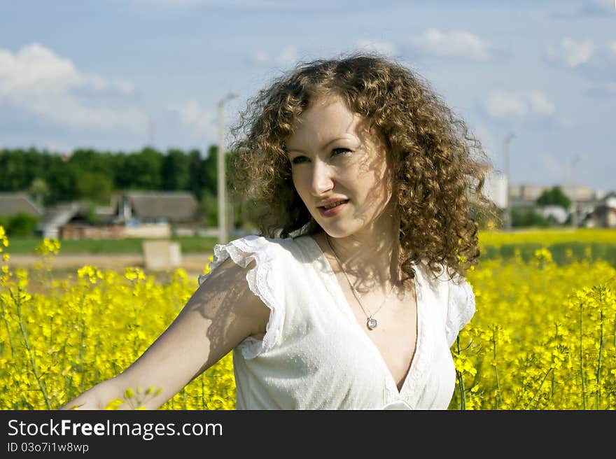 Beautiful curly girl on nature