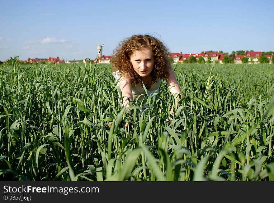 Smiley curly girl on nature