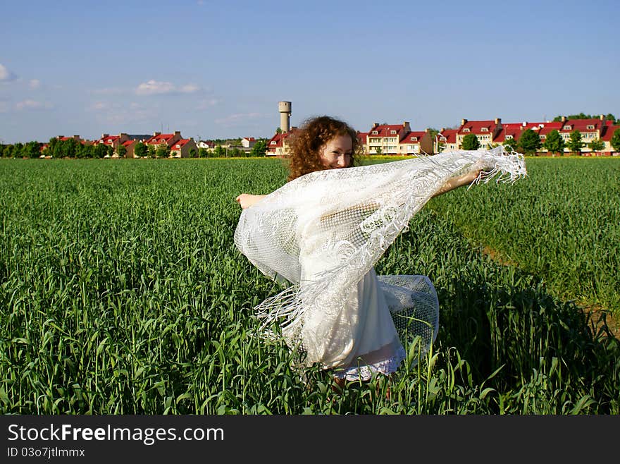 Curly girl dancing on nature