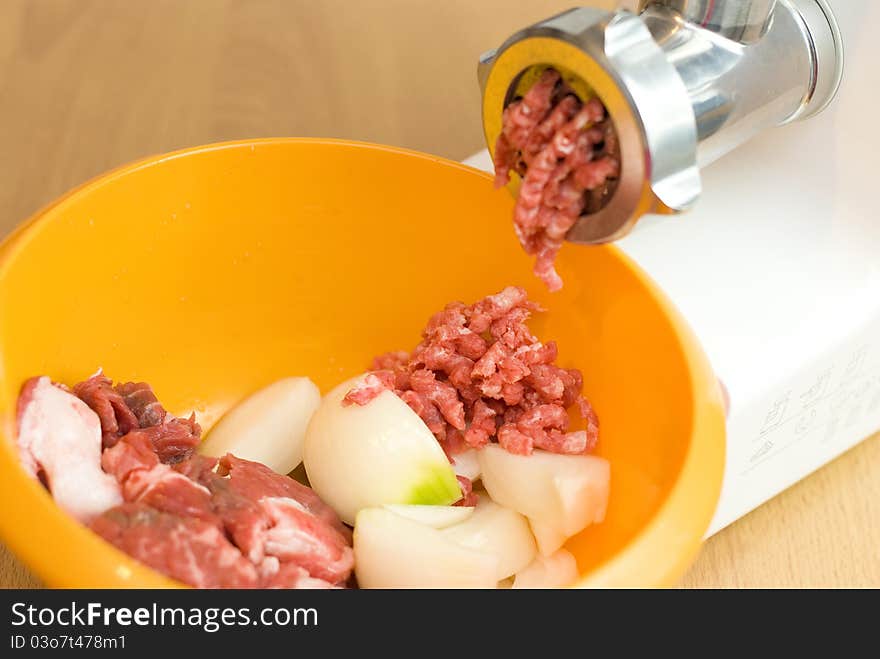 Meat through a meat grinder for force meat