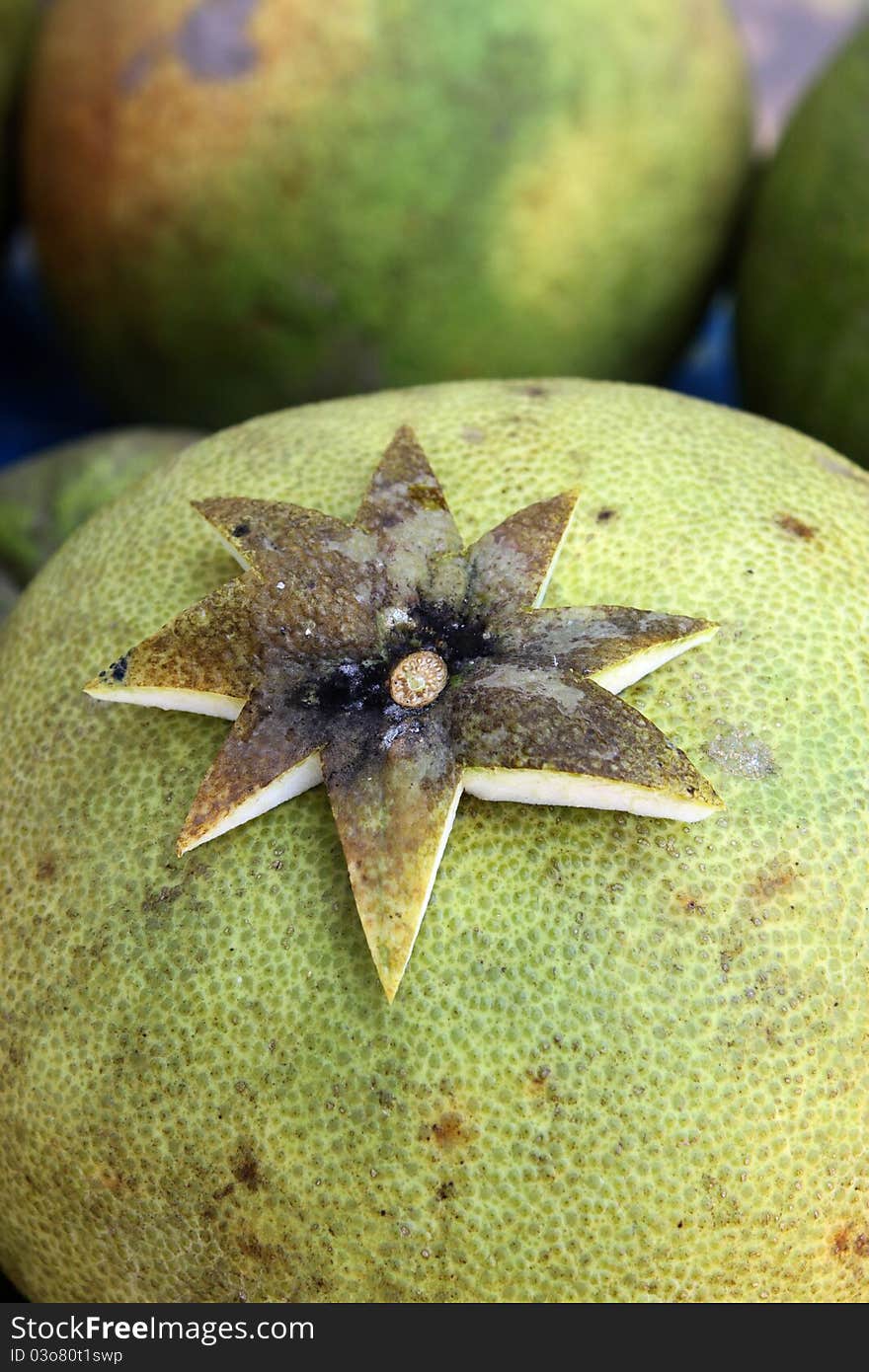 Cutting of eight star shape pomelo skin laying on its fruit