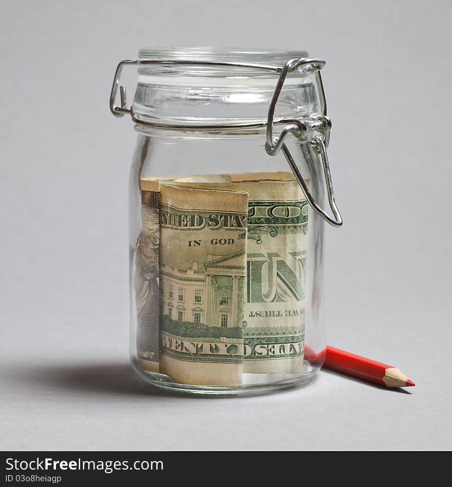 Savings concept with dollar and red pencil. Savings concept with dollar and red pencil