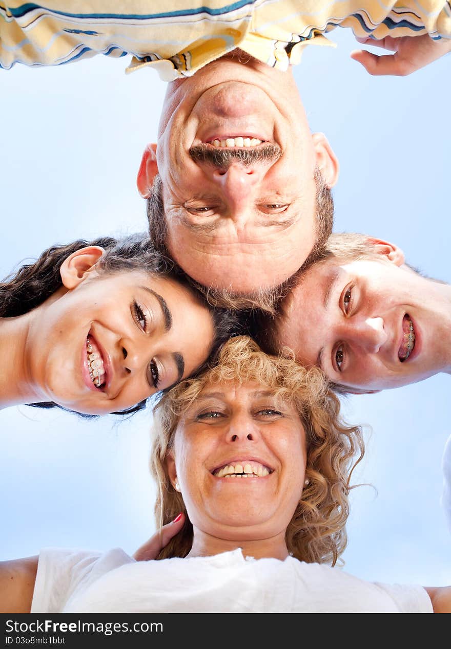 Beautiful family. Heads together, outdoor scene