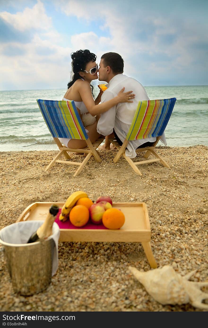 Couple Resting On The Beach